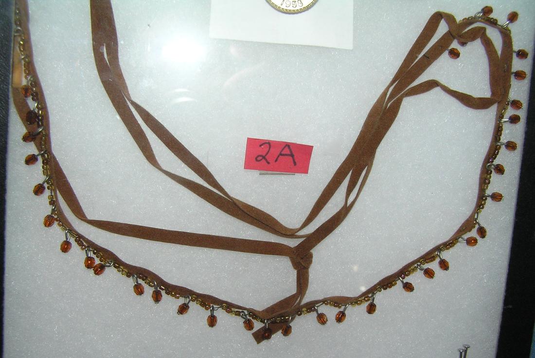 Beaded/leather necklace w/ multi colored & amber stones: Beaded and leather necklace with multi colored and amber stones est. value $25.00-$30.00