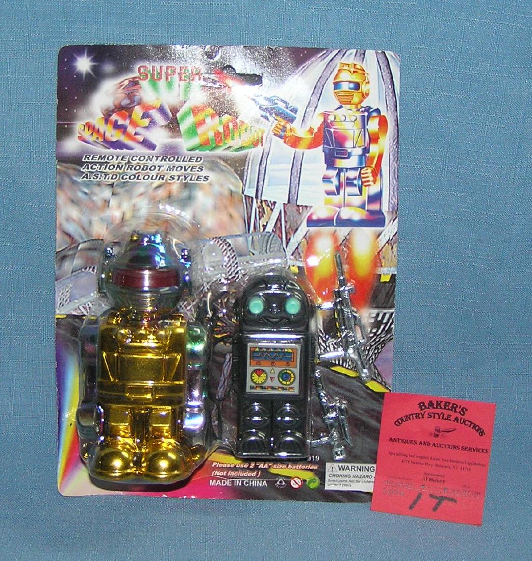 Battery operated mechanical robot toy: Battery operated mechanical robot toy with weapons mint on card est. value $20.00-$25.00