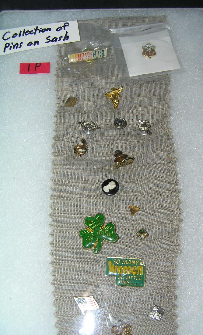 Collection of vintage pins: Collection of vintage pins on a sash includes ceremonial, organizational, Masonic, Knights of Columbus and much more est. value $40.00-$50.00