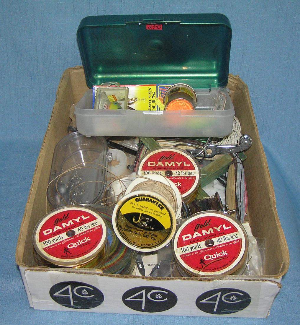 Group of vintage and modern fishing equipment: Group of vintage and modern fishing equipment includes lures, reel spools, line, sinkers and more est. value $65.00-$75.00