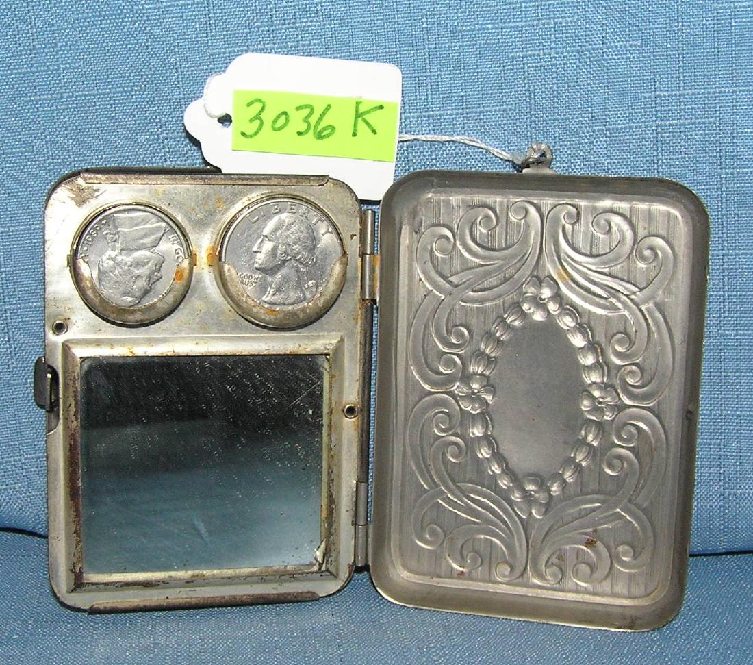 Antique change purse/compact case: Antique change purse/compact case with mirror all chrome plated with hanging chain marker nickle silver 1930's-40's est. value $40.00-$50.00