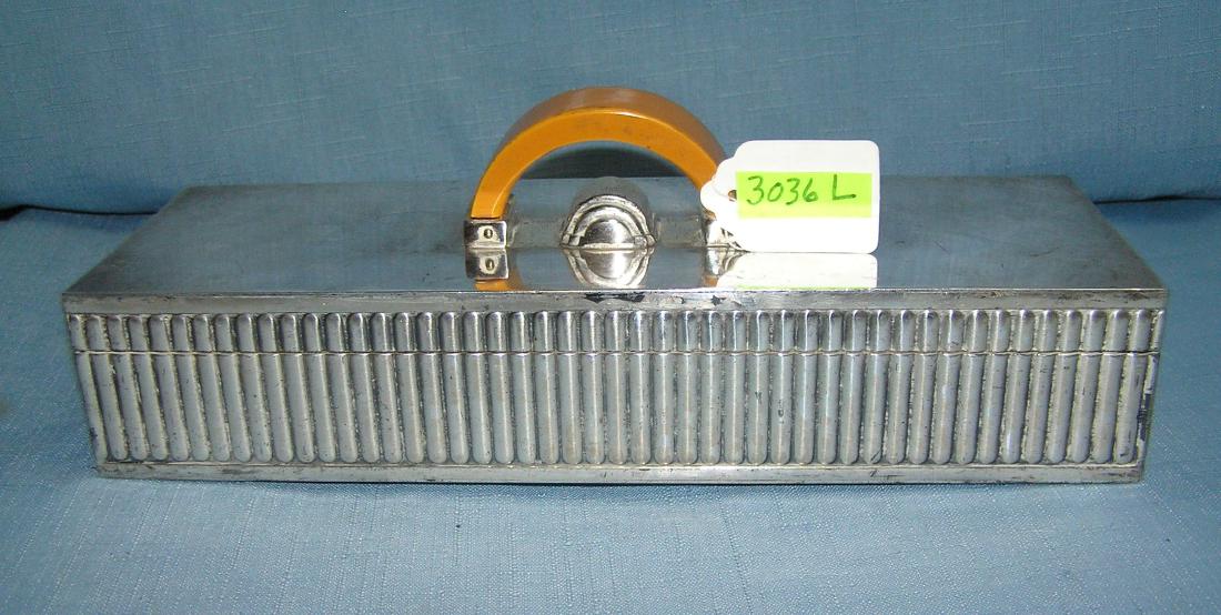 Art Deco counter top cigarette holder/display case: Antique silver plated Art Deco counter top cigarette holder/display case featuring four brand name hloders including Camels, Lucky Strikes, Chesterfields and Old Golds mfg. by the Preference Chest Mfg