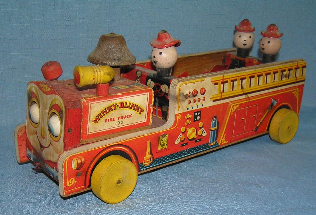 Fisher Price bell ringing mechanical fire dept pull toy: Early lithographed Fisher Price bell ringing mechanical fire dept pull toy circa 1950's est. value $125.00-$175.00