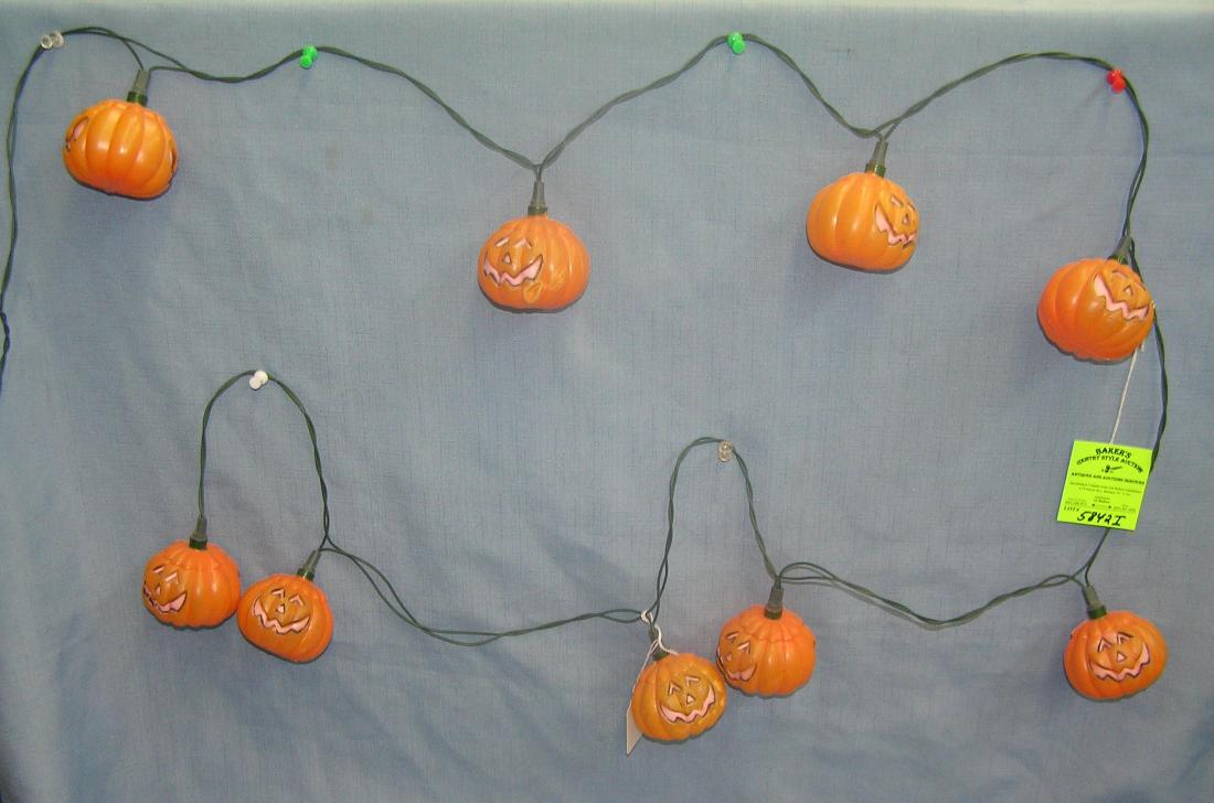 Jack O' Lantern Halloween lights: Set of vintage Jack O' Lantern themed electric illuminated hanging Halloween lights featuring 9 decorative Jack O' Lanterns est. value $35.00-$40.00