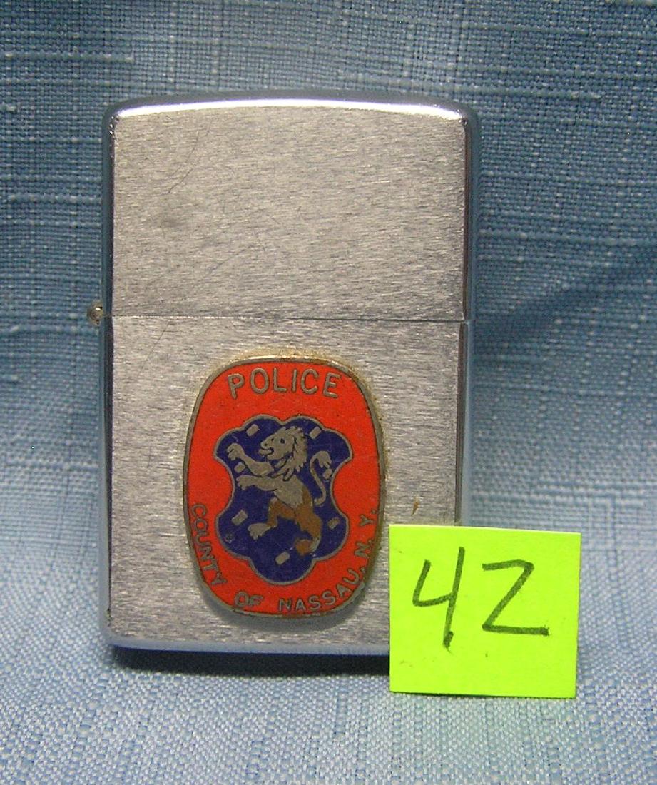 Nassau County policeman's Zippo lighter: Vintage Nassau County policeman's Zippo cigarette lighter est. value $90.00-$100.00