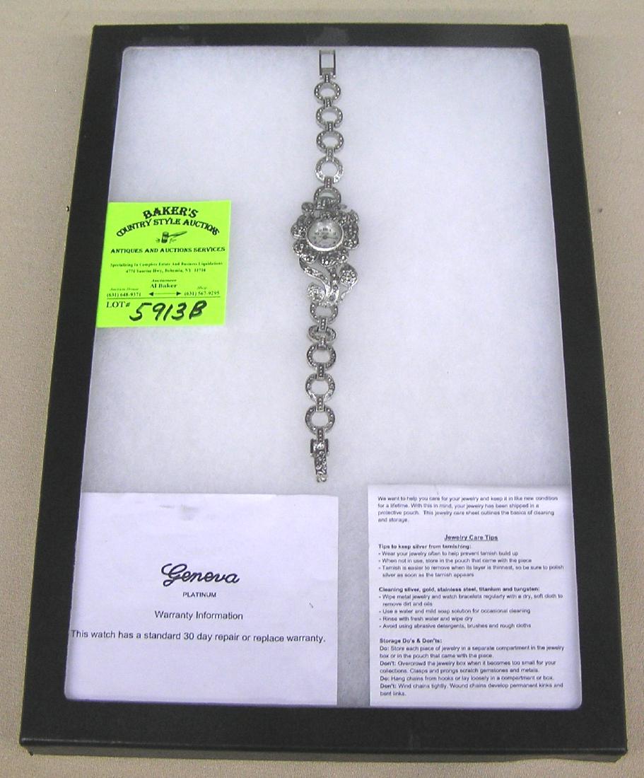 Quality costume jewelry wrist watch by Geneva: Quality costume jewelry wrist watch by Geneva, platimum with original warrenty and paperwork est. value $50.00-$75.00