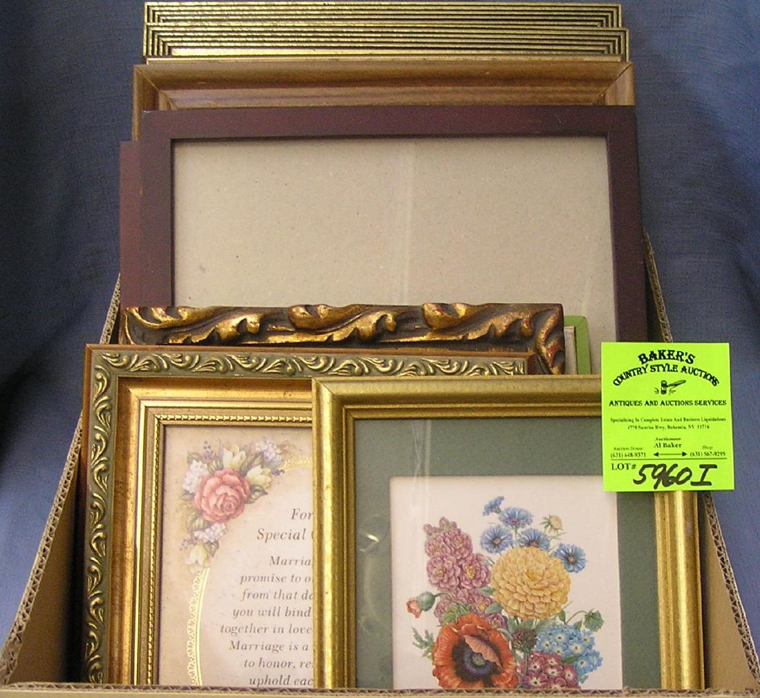 Box full of vintage picture frames some with artwork: Box full of vintage picture frames some with artwork $65.00-$75.00
