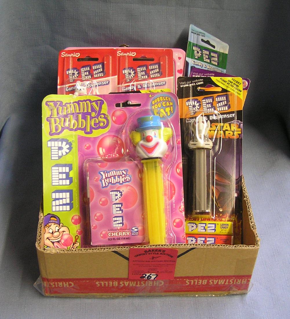 Box full of vintage PEZ candy containers: Box full of vintage PEZ candy containers est. value $100.00-$150.00