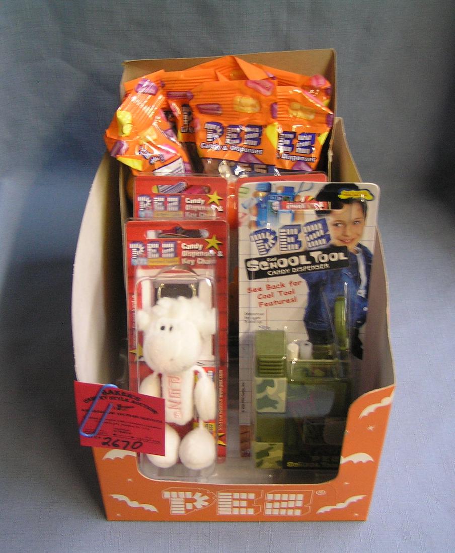 Box full of PEZ candy containers: Box full of vintage PEZ candy containers est. value $100.00-$125.00