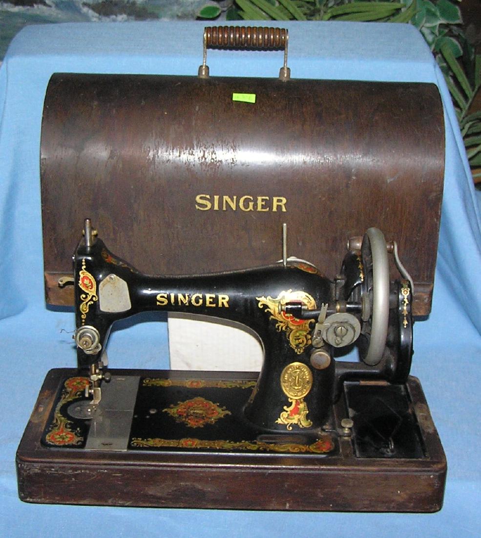 Antique Singer sewing machine: Antique Singer sewing machine all stenciled decorated in gold leaf with hand crank handle late 1800's excellent condition in original dase est. value $325.00-$350.00