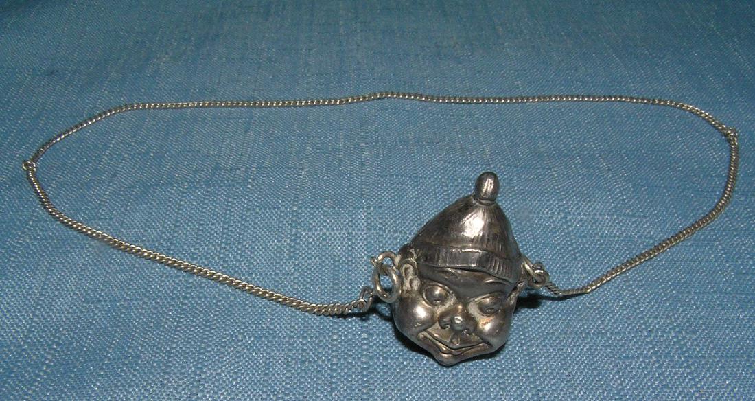 Two faced Brownie charm necklace silver: Two faced Brownie charm necklace silver circa eqrly 1900's est. value $125.00-$150.00