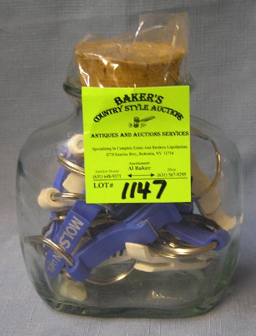 Glass jar full of key chains and bottle openers: Glass jar full of Bud light and Molson key chains and bottle openers $25.00-$30.00