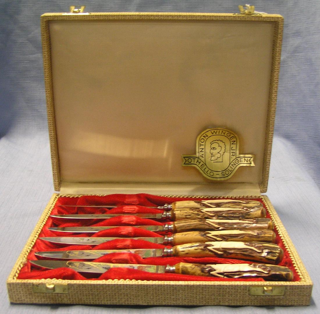 Super high quality bone handled knife set: Super high quality bone handled knife set with hunting themed engraved blades by Anton Wingen Jr. made in Solingen Germany completer set of 6 with original display case, mint in case est. value $425.0