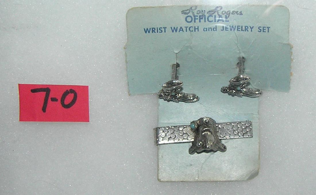 Roy Roger's western themed tie clip and cuff link set: Roy Roger's western themed tie clip and cuff link set mint on card est. value $30.00-$40.00