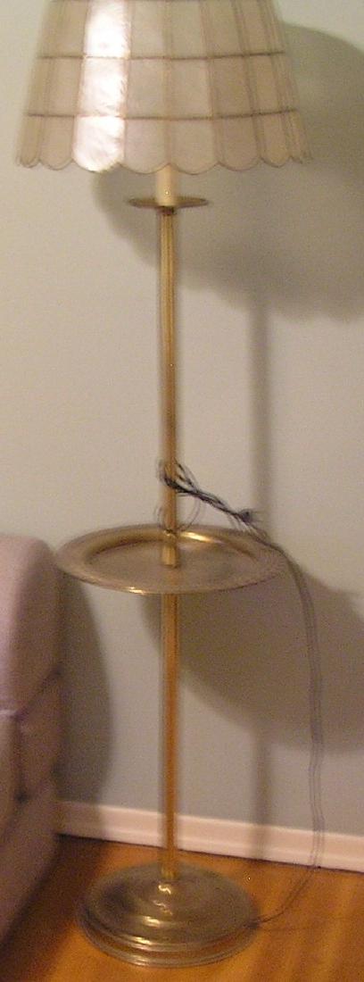 Vintage brass floor lamp: Vintage brass floor lamp with shell and brass shade est. value $125.00-$150.00
