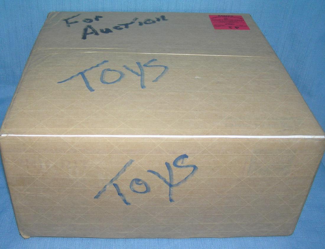 Moving and Storage Company mystery box marked toys: Moving and Storage Company mystery box lot marked toys est. value $25.00-$30.00