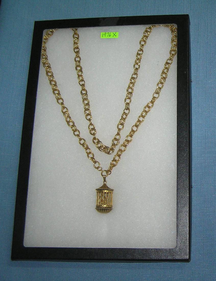 Vintage bird cage shaped compact necklace: Great vintage bird cage shaped compact necklace compact with decortaive bird inside cage and hinged makeup recptacle with heavy chain est. value $175.00-$200.00