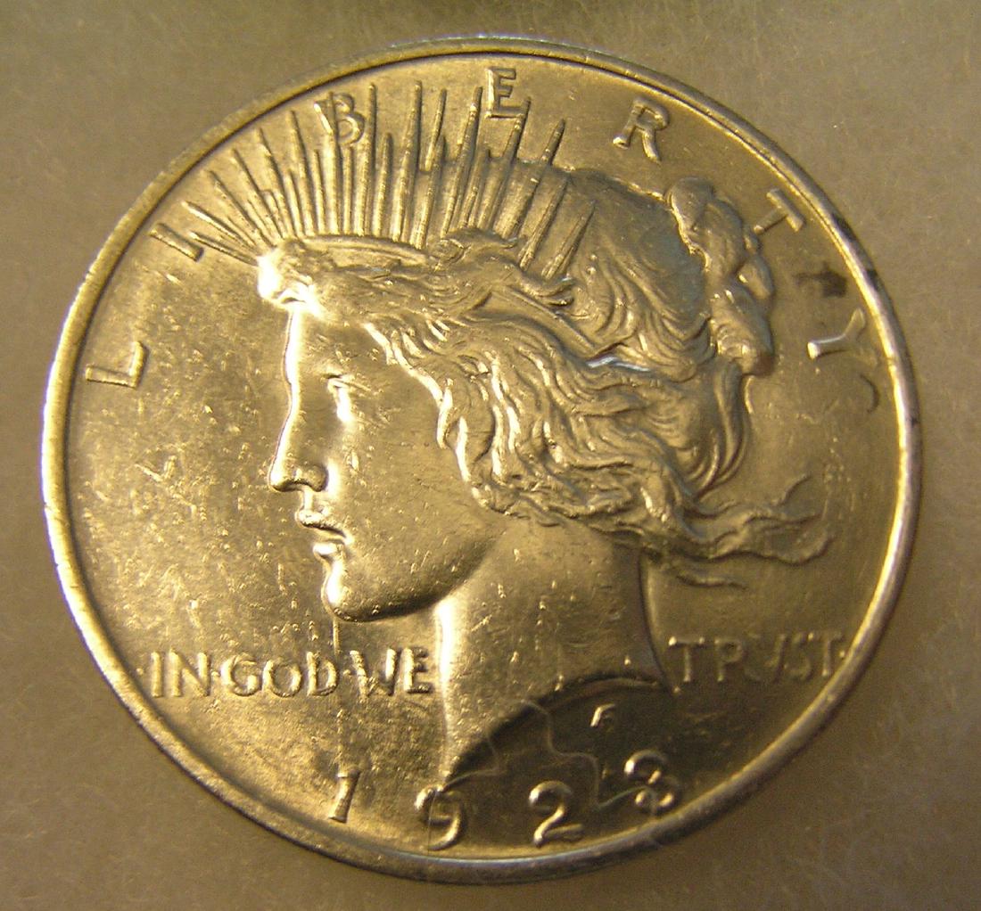 1923 Lady Liberty Peace silver dollar: 1923 Lady Liberty Peace silver dollar in very fine condition est. value $50.00-$60.00, part of an 86 year old gentleman's safety deposit box collection/hoard
