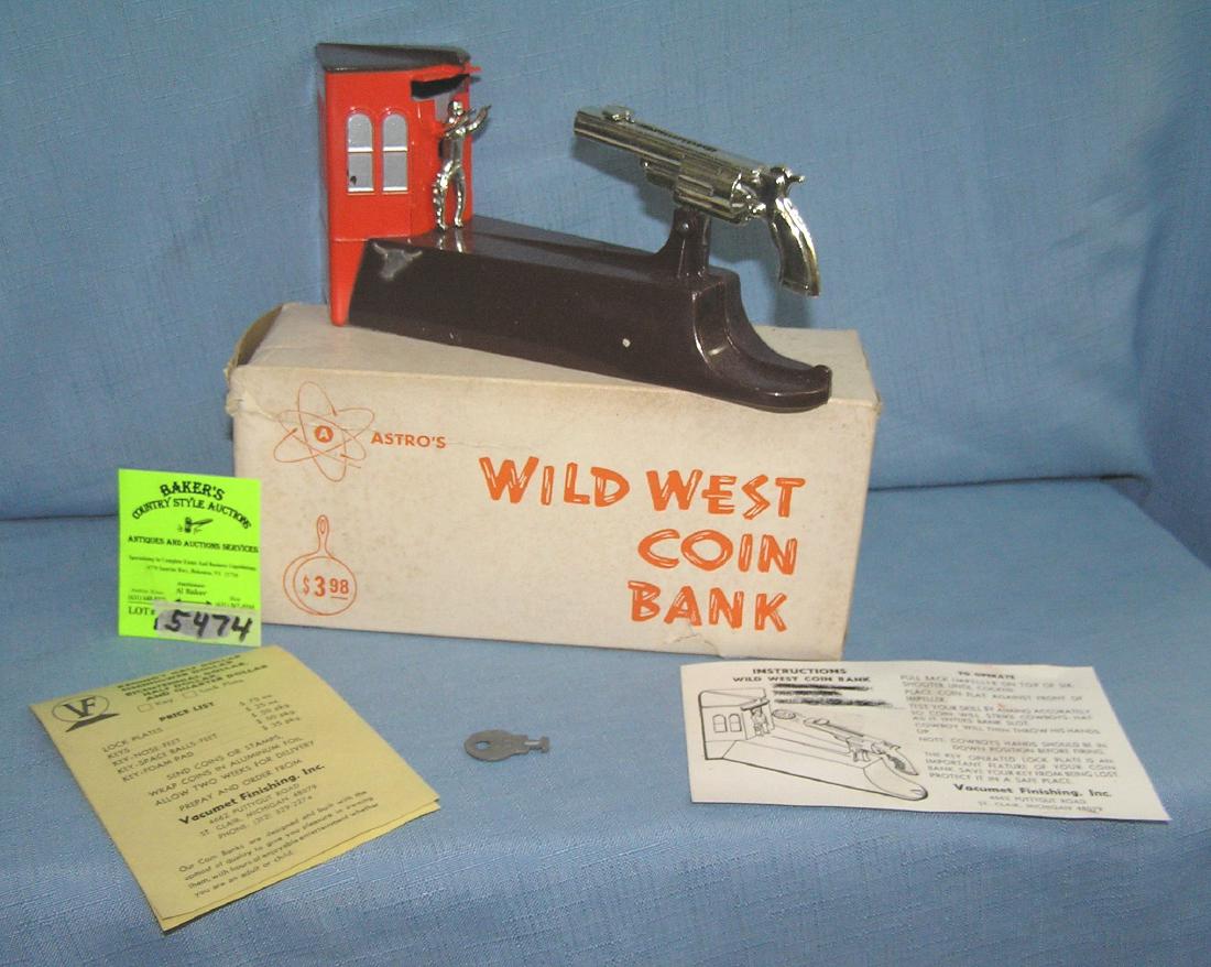 Vintage Wild West bank circa 1950's: Vintage Wild West bank all hand painted cast metal circa 1950's with original key, box and documents est. value $200.00-$225.00