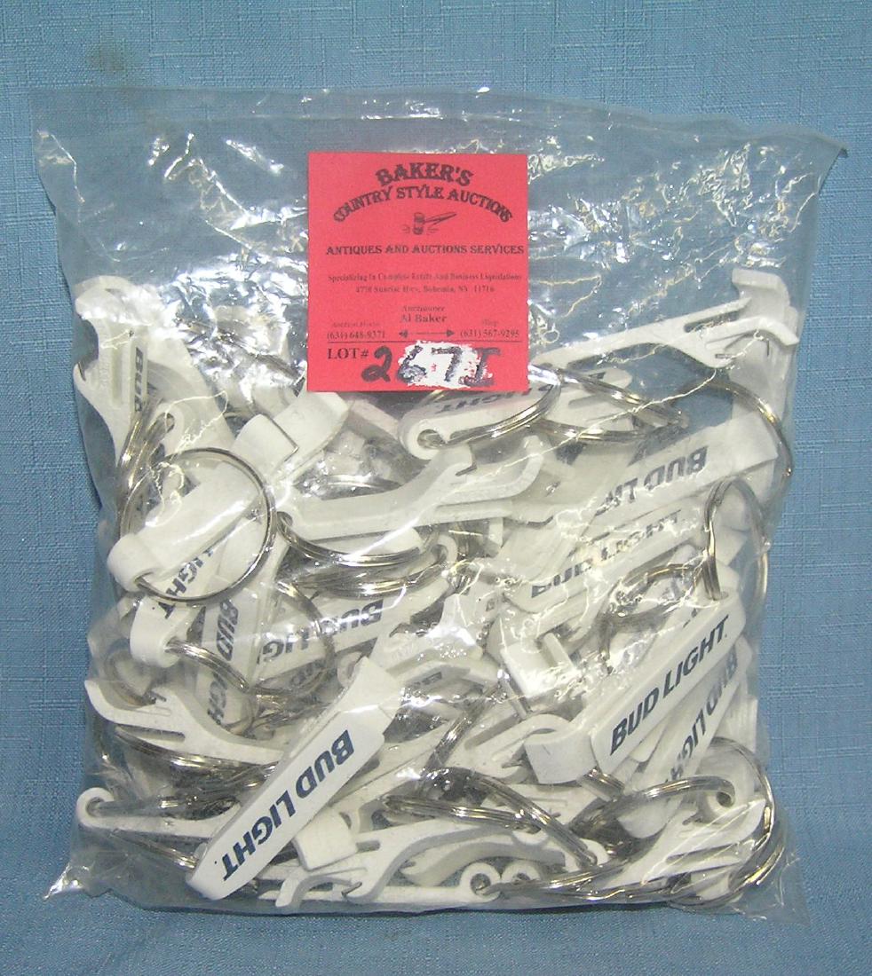 Bag full of Bud Light advertising key chains: Bag full of Bud Light advertising key chains, 100 pieces, new old stock est. value $40.00-$50.00
