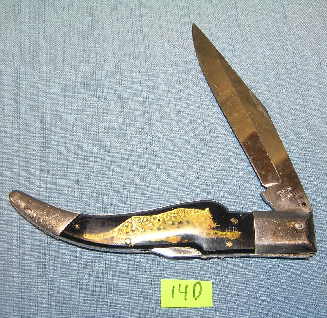 Leopard decorated pocket knife: Leopard decorated pocket knife est. value $40.00-$50.00