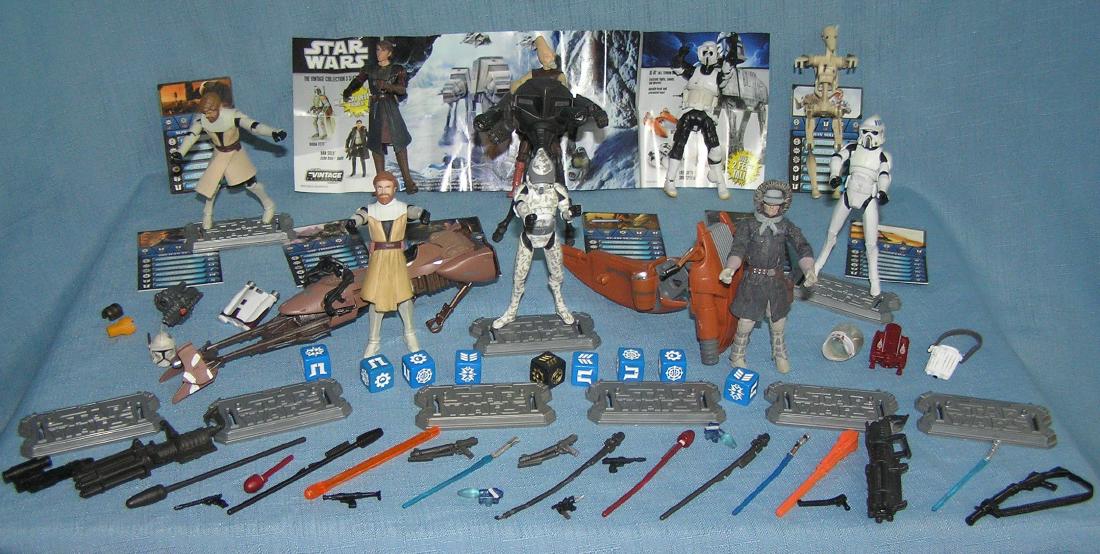 Star Wars action figures, vehicles, stands and: Large group of vintage Star Wars action figures, vehicles, stands and accessories includes loads of various weapons, catalog brochure figural identification card and more est. value $125.00-$150.00
