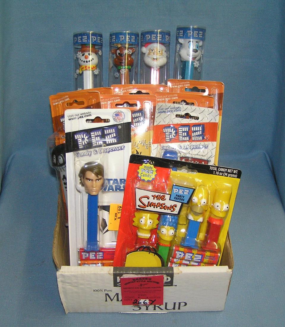 Box full of vintage PEZ candy containers: Box full of vintage PEZ candy containers est. value $100.00-$150.00