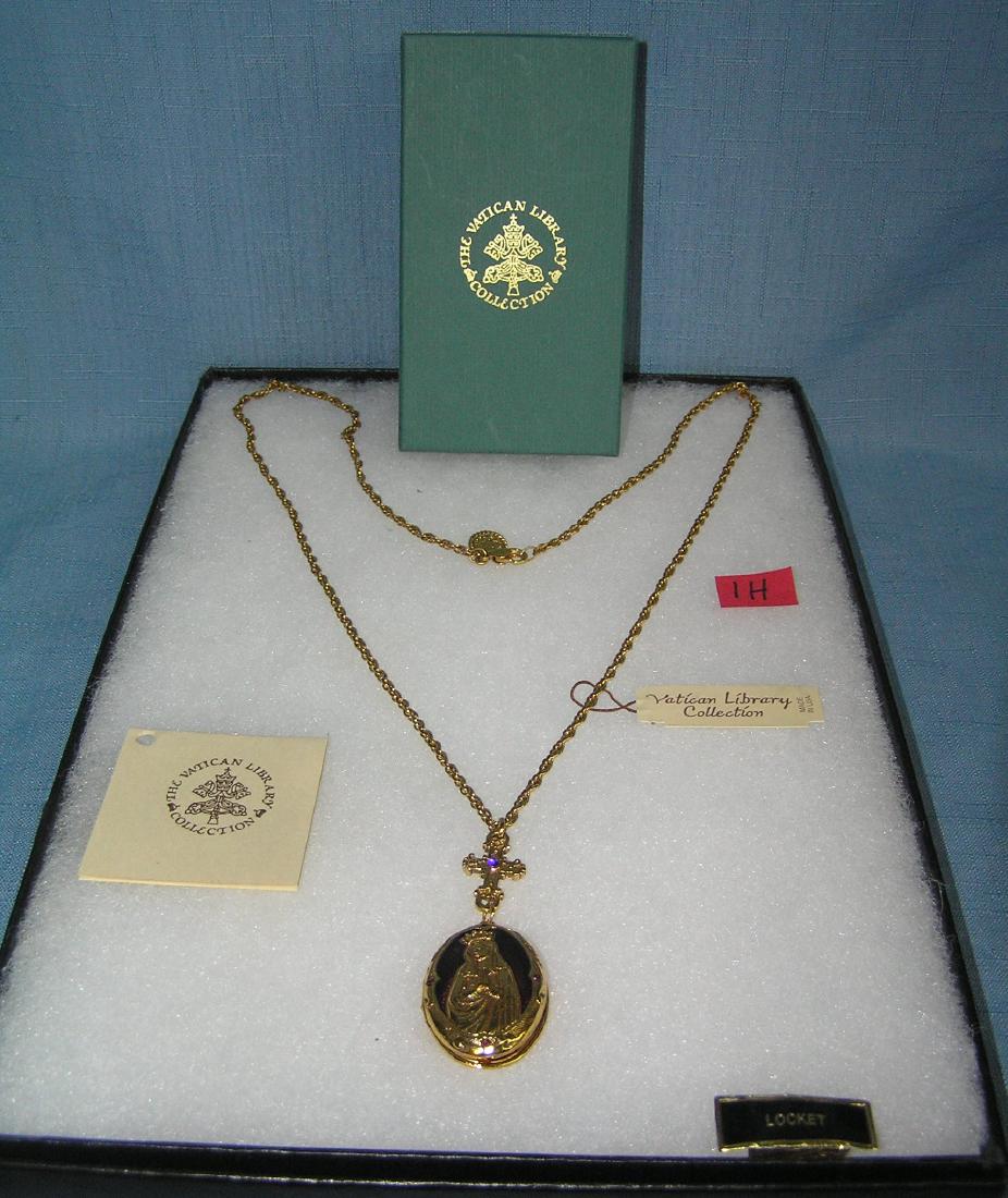 Gold toned Blessed Mother necklace with locket: Gold toned Blessed Mother necklace with locket from the original Vatican Library collection with original box and paper work est. value $175.00-$200.00