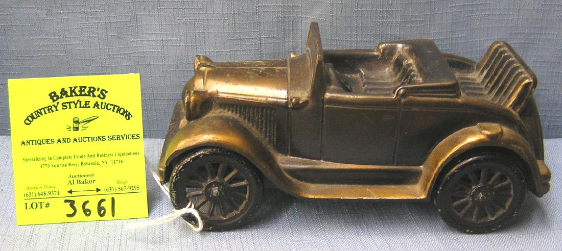 Ford open two seated coupe with rumble seat: Vintage cast metal 1929 Ford open two seated coupe with rumble seat est. value $50.00-$75.00