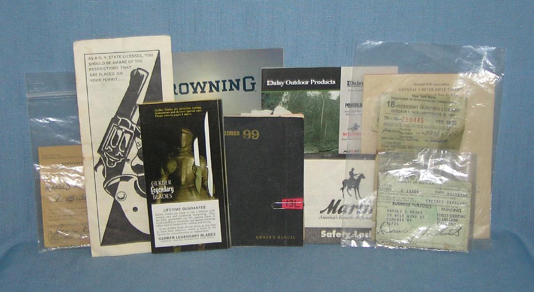 Collection of gun and knife related ephemera and: Collection of gun and knife related ephemera and collectibles including Browning, Gerber, Crossman, Daisy, Marlin, hunting licenses and more est. value $65.00-$75.00