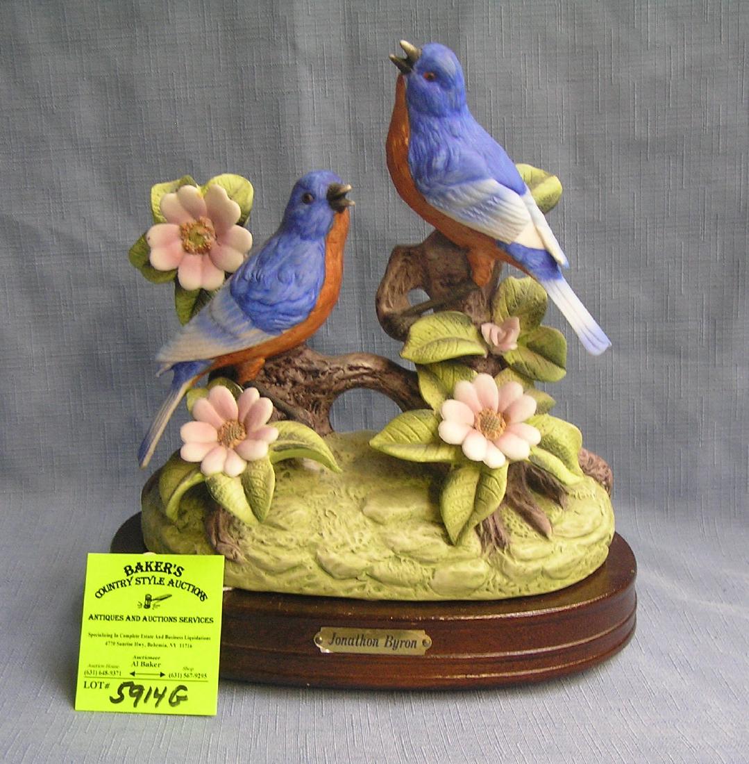 Artist signed hand painted chirping bird figurine: Artist signed hand painted chirping bird figurine on wood base signed Jonathan Byron by Royal Carleton fine china est. value $75.00-$80.00