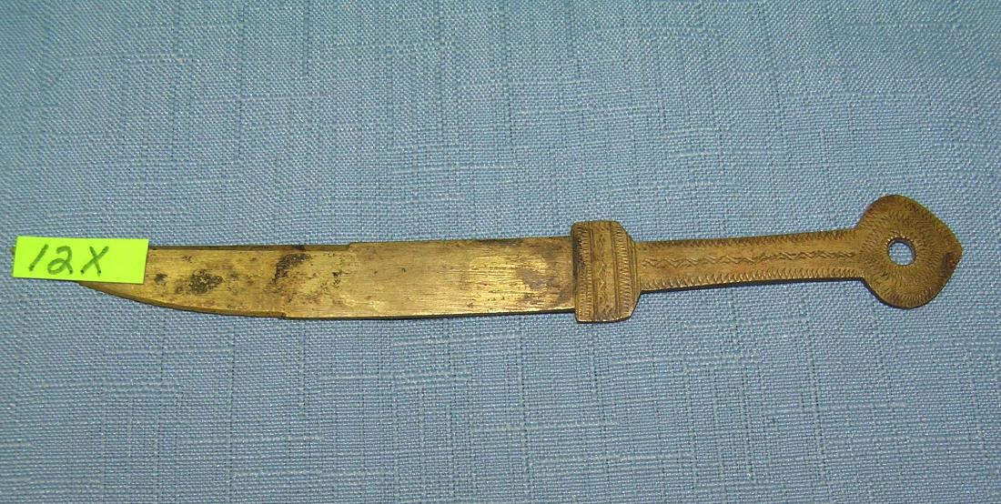 Hand made brass knife shaped letter opener: Hand made brass knife shaped letter opener with fancy etched cut handle all hand made circa early 1900's est. value $65.00-$75.00