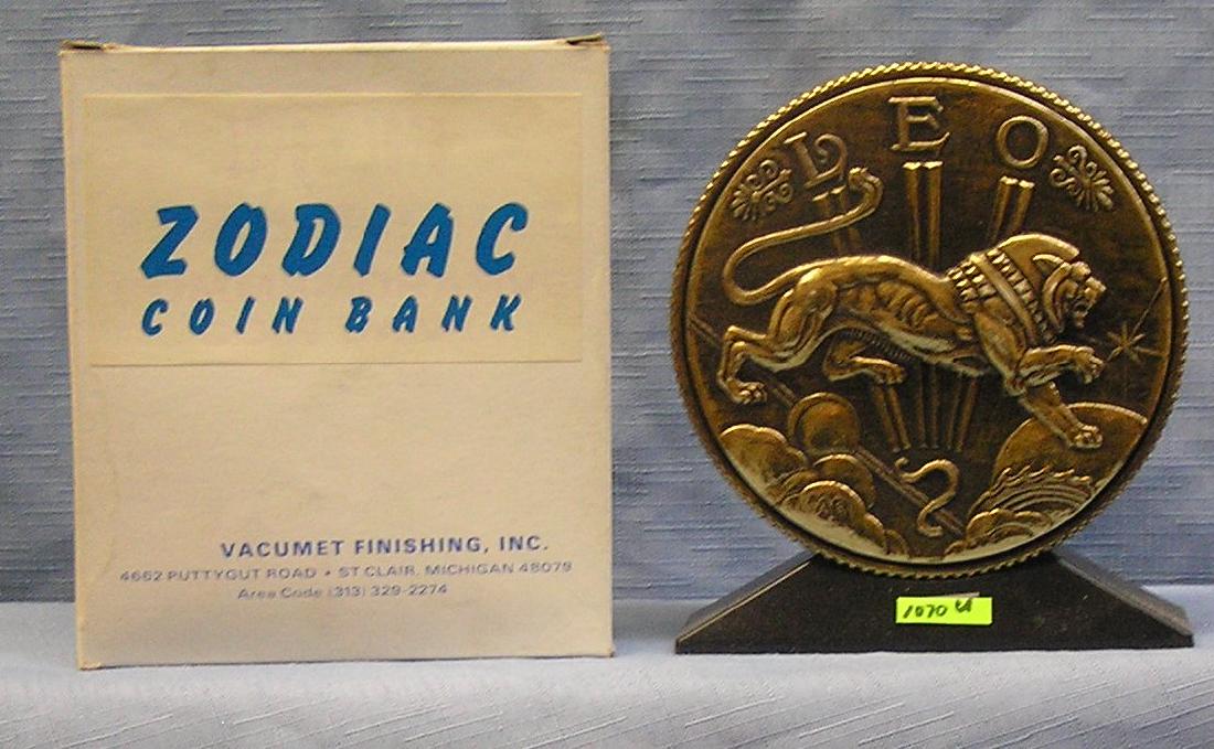 Vintage cast metal zodiac bank Leo: Vintage cast metal zodiac bank Leo with original box $65.00-$75.00