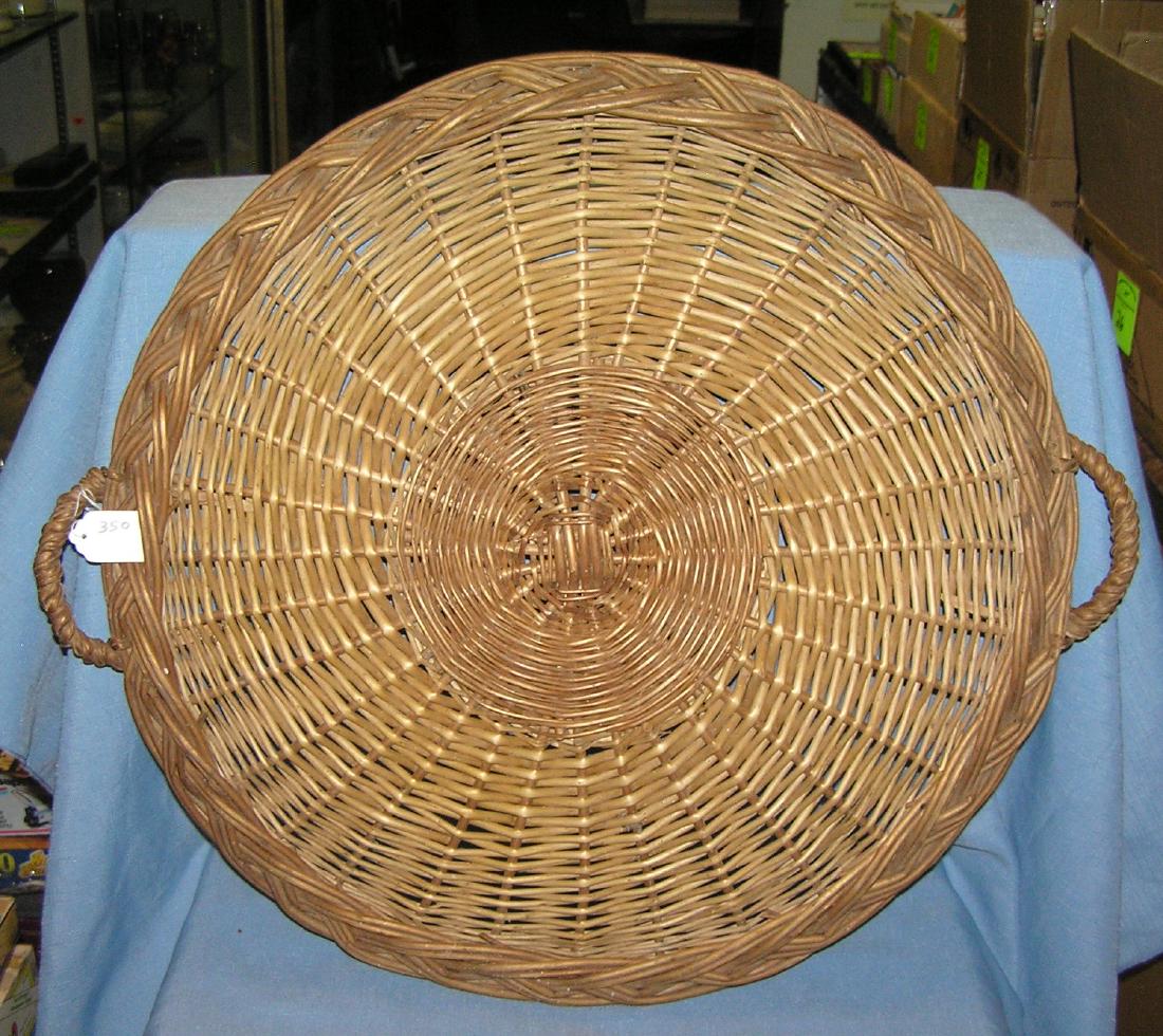 Large circular handmade wicker serving platter: Large 21 inch circular handmade wicker serving platter circa 1950's est. value $40.00-$45.00