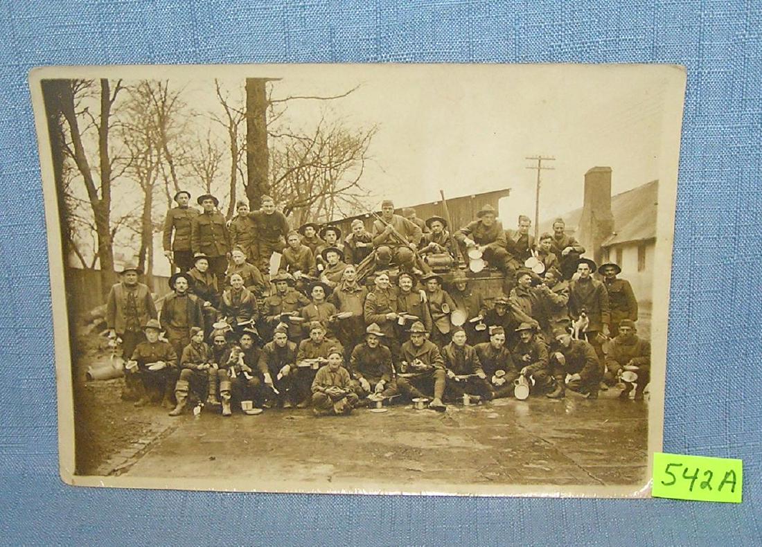 Early WWI soldier's photograph: Early WWI soldier's photograph from Camp Pontaneyer, the picture is of soldiers in full uniform with their weapons, mascots and accessories est. value $75.00-$80.00