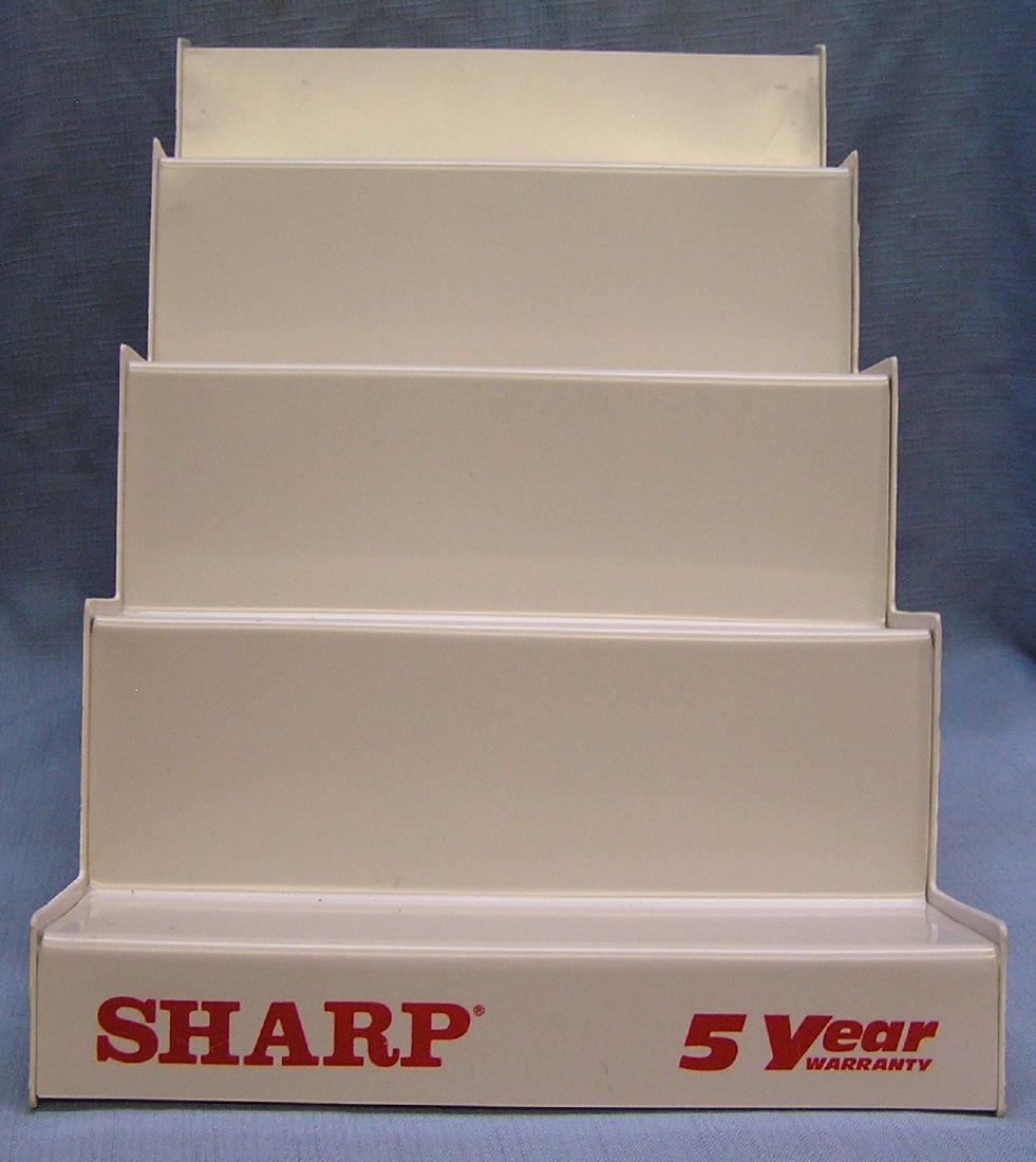 Sharp wrist watch advertising display stand: Sharp wrist watch advertising 4 tier store display stand, mint old store stock, never distributed or used est. value $50.00-$75.00