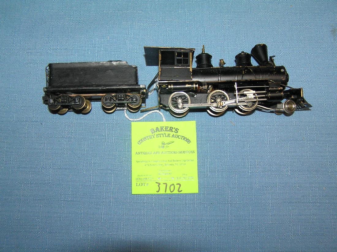 Vintage scale painted brass engine and coal tender: Vintage scale painted brass engine and coal tender est. value $150.00-$200.00