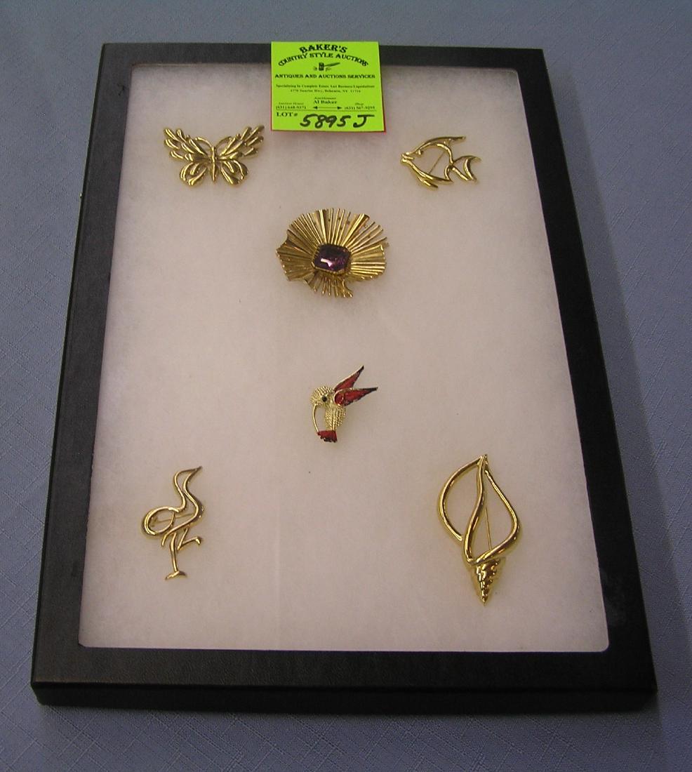 Collection of all signed Trifari pins: Collection of all signed Trifari pins est. value $75.00-$100.00