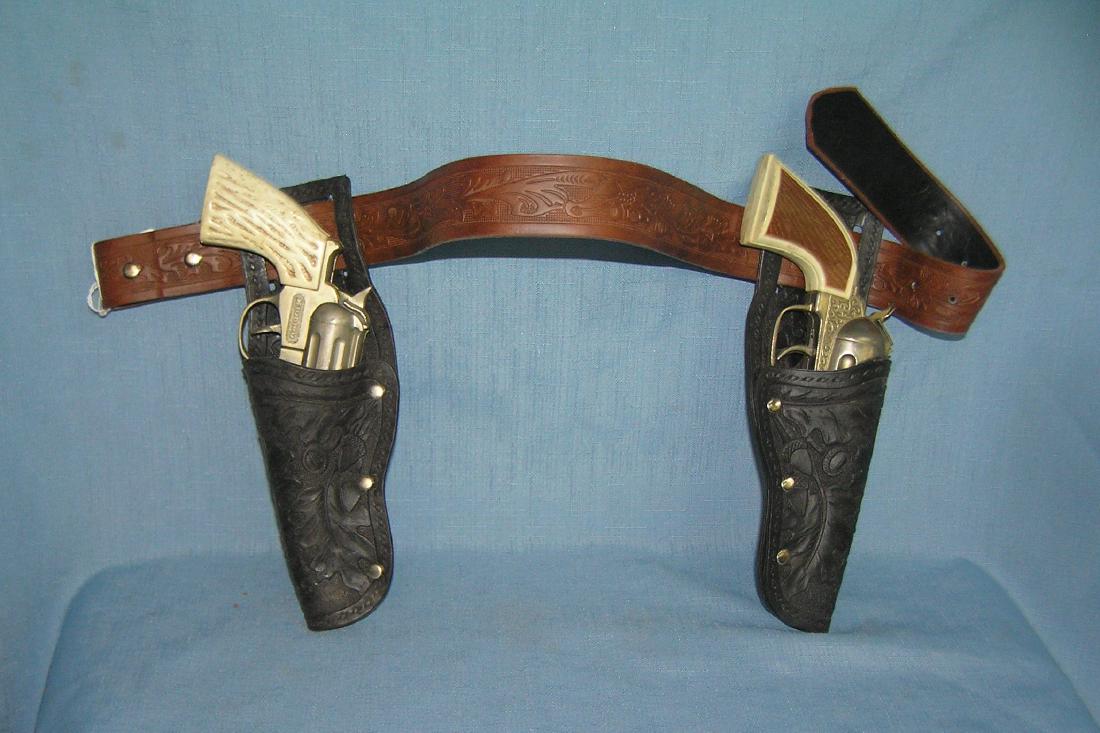 Pair of Hubley cap guns and holster set: Pair of Hubley cap guns and holster set circa 1950's-60's est value $125.00-$150.00