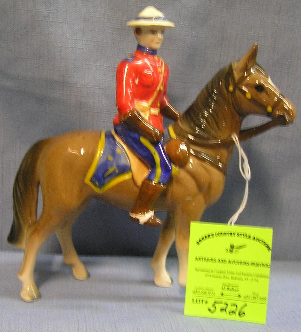 Canadian royal police figure on horseback: Hand painted porcelain Canadian royal police figure on horseback est. value $150.00-$200.00