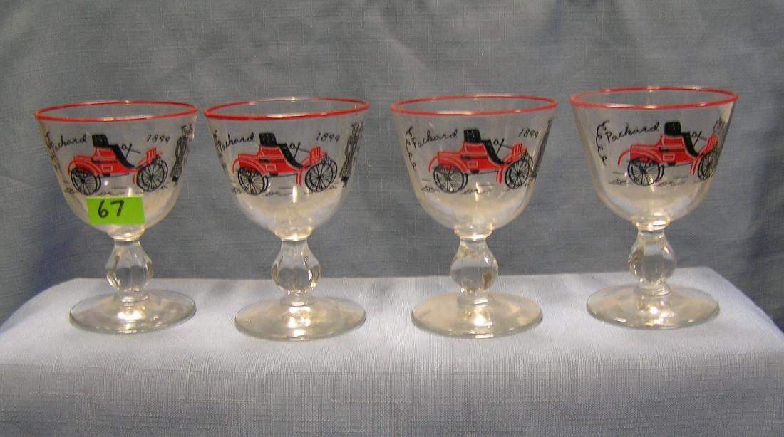 Antique horseless carriage drink glasses: Set of Four antique horseless carriage automobile drink glasses featuring the 1899 Packard est. value $100.00-$125.00