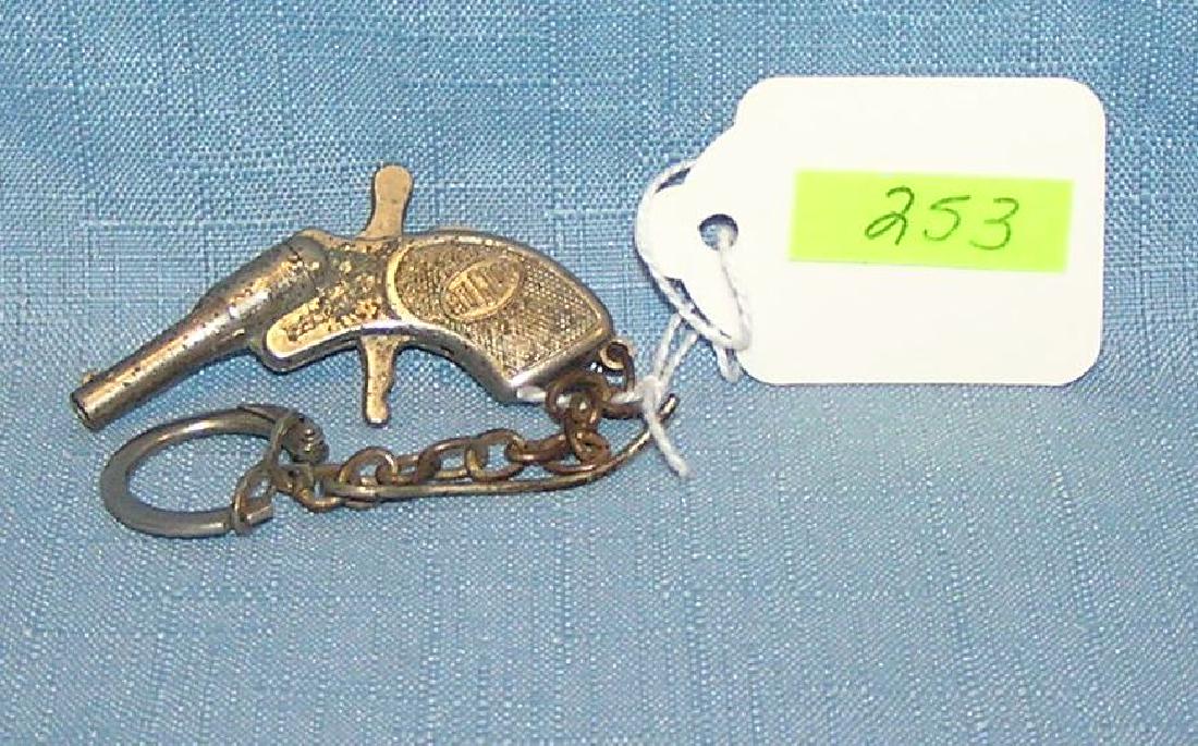 Molgora cast metal revolver cap gun/key chain: Early Molgora cast metal revolver cap gun/key chain circa 1930’s est. value $65.00-$75.00