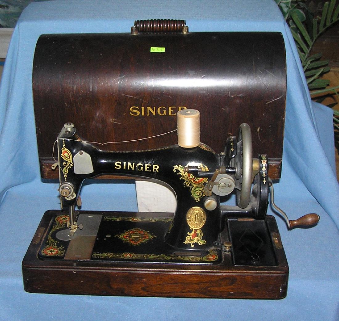 Antique Singer sewing machine: Antique Singer sewing machine all stenciled decorated in gold leaf with hand crank handle late 1800's excellent condition in original dase est. value $325.00-$350.00