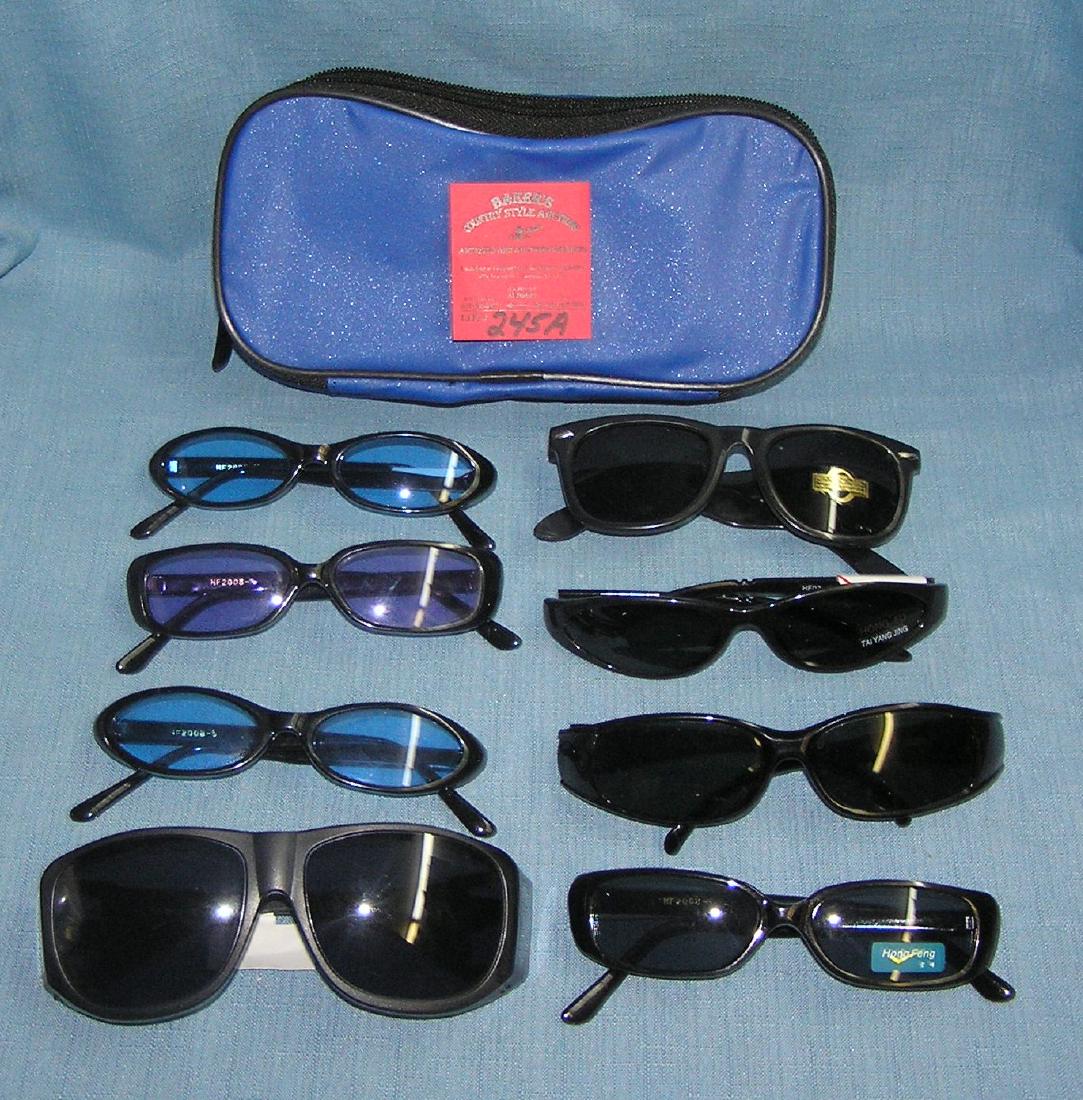 Large group of new sunglasses: Large group of new sunglasses with large storage case est. value $50.00-$60.00