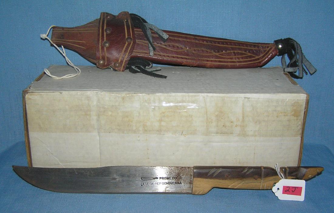 Vintage souvenir machete with leather sheath: Vintage souvenir machete with leather sheath all hand and custom made est. value $200.00-$250.00