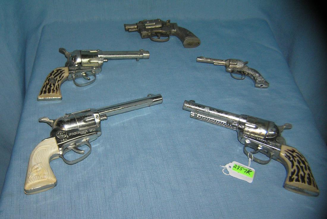 Group of 5 all cast metal cap guns: Group of 5 all cast metal cap guns inc. shootin' shell, farmers by Mattel, Fanner 50 by Mattel toys, Roy Rogers and a Trooper by Hubley same condition as found est. value $175.00-$200.00