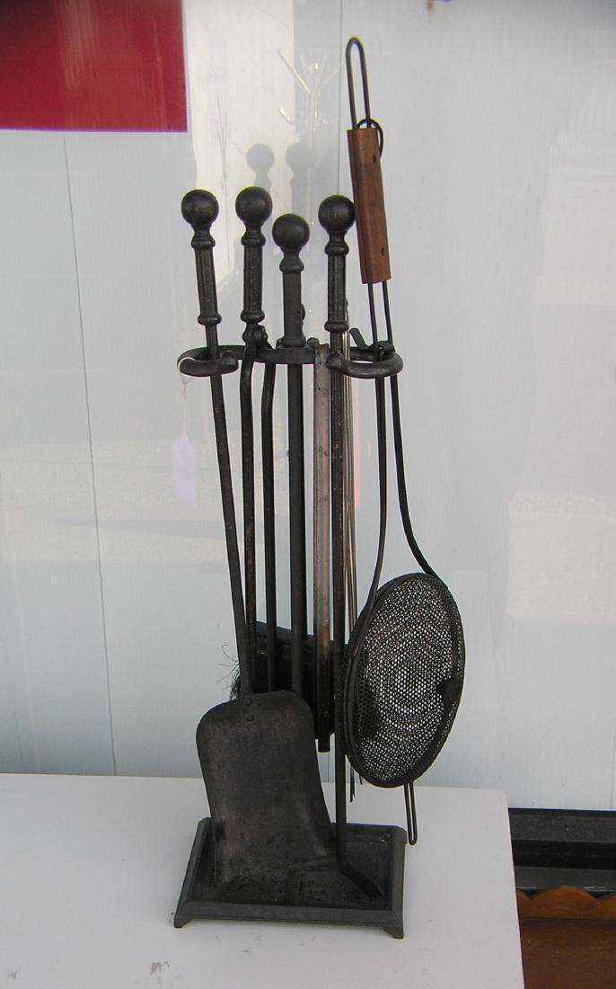 Seven piece wrought iron fire place tool set: Seven piece wrought iron fire place tool set part of a moving and storage company seized merchandise liquidation est. value $125.00-$200.00