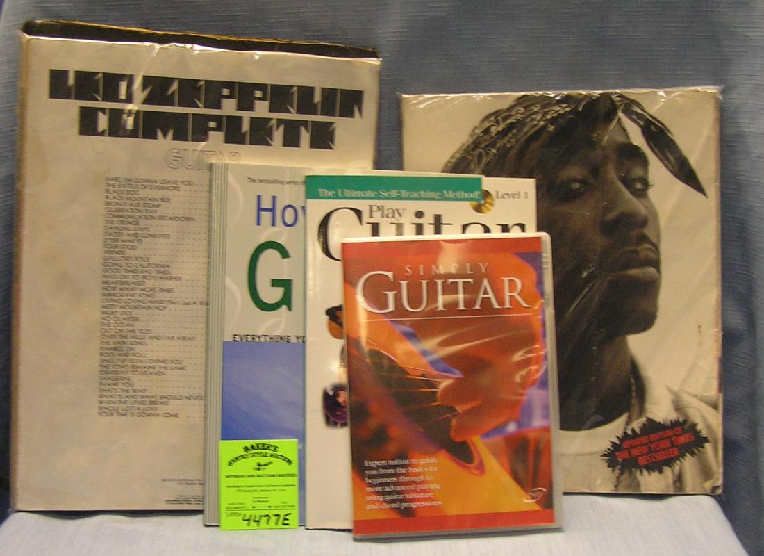 Group of guitar and keyboard music books and more: Group of guitar and keyboard music books and more group also includes Complete Led Zepplin guitar book, Tupac ShakurLife Story Book and an antique Mozart sheet music book, 7 pieces total est. value $1