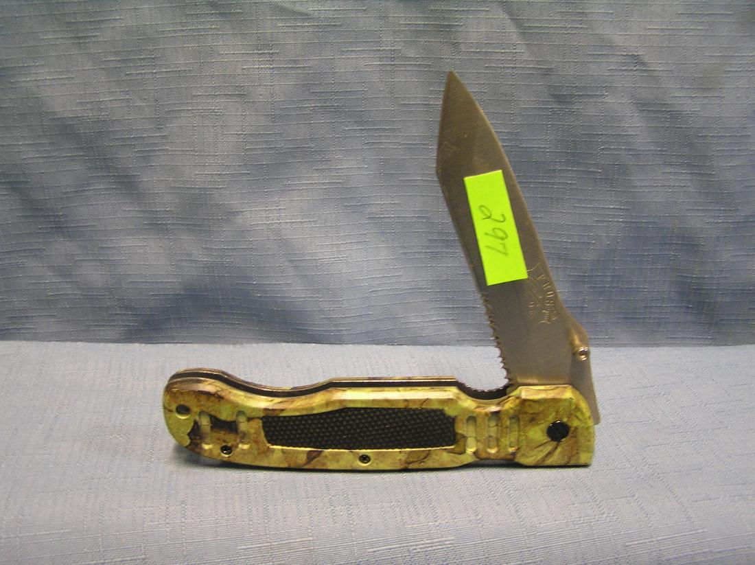 Camo pocket knife by Frost Cutlery: Camo pocket knife by Frost Cutlery mint condition est. value $30.00-$40.00