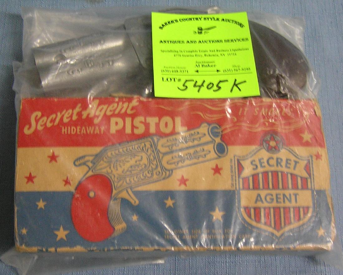 Secret agent hideaway pistol cap gun with original box: Secret agent hideaway pistol cap gun with original box circa 1940’s-50’s est. value $150.00-$200.00